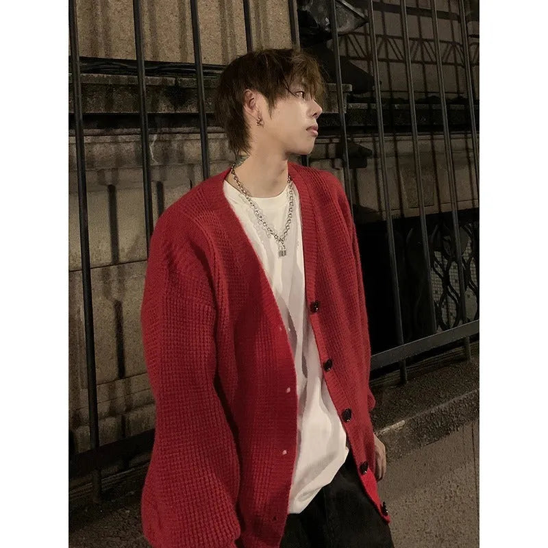 Men's loose-fit V-neck cotton blend cardigan sweater in army green, shown on a hanger.