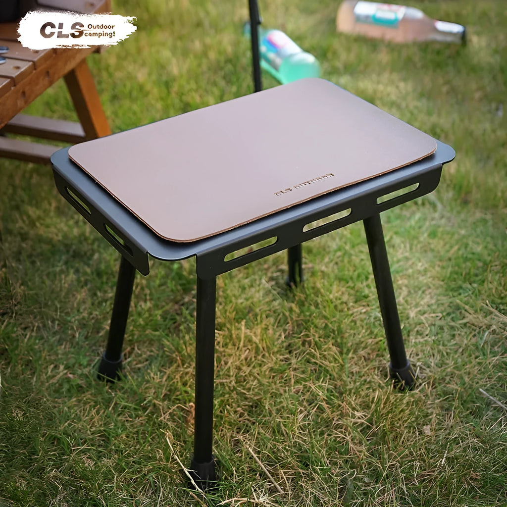 CLS Outdoor aluminium folding camping stool with PU cushion next to its bag that converts into a small table.