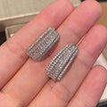 Geometric copper stud earrings with inlaid zircon stones in white gold colour