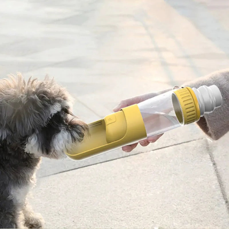 A dark blue portable dog water bottle with an integrated drinking bowl, shown with its leak-proof cap.