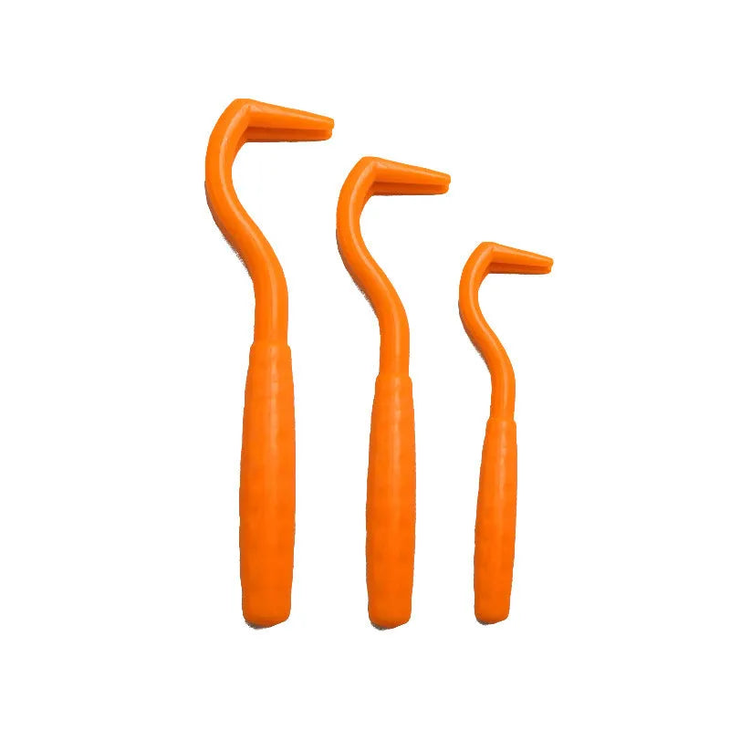 Set of three coloured plastic tick removal hooks for pets on a white background.