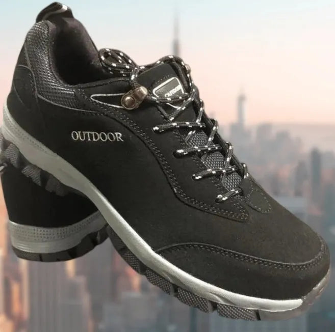 Men's army green low-top hiking shoes on a neutral background, showing the casual design and tread.