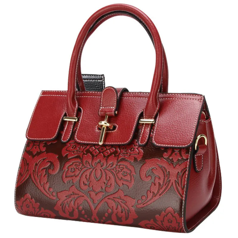 Genuine leather vintage crossbody bag with oval shape and embossed pattern in black colour