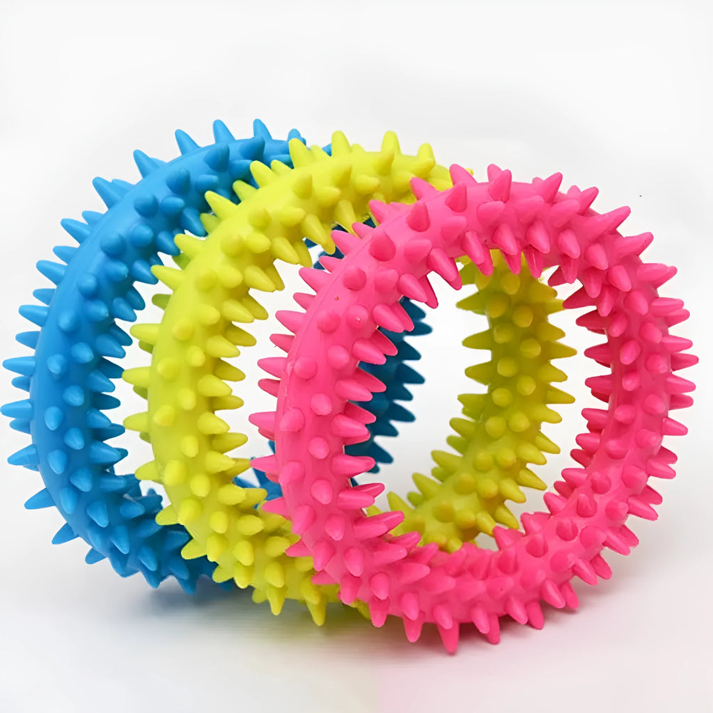 Blue TPR spiky ring dog chew toy with dental cleaning nubs on a white background