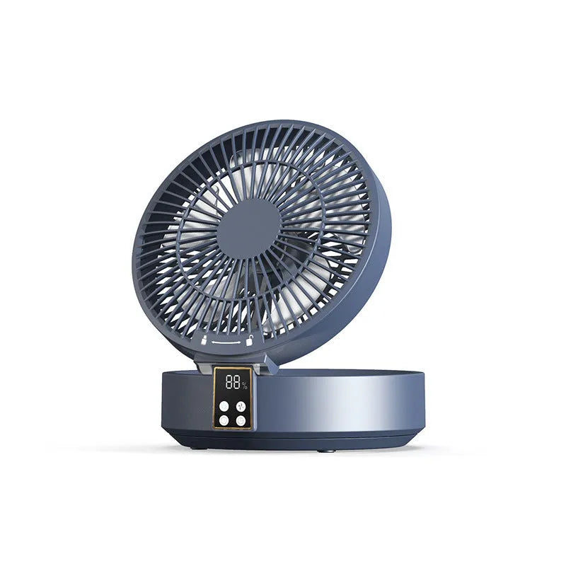 White portable USB rechargeable folding desk fan with remote control on wooden surface