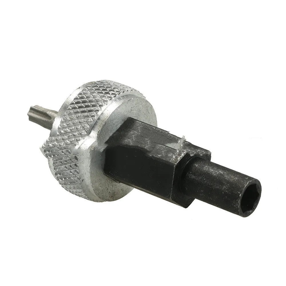 Close-up of an ignition module wrench tool with aluminium knurled knobs on a carbon steel handle.
