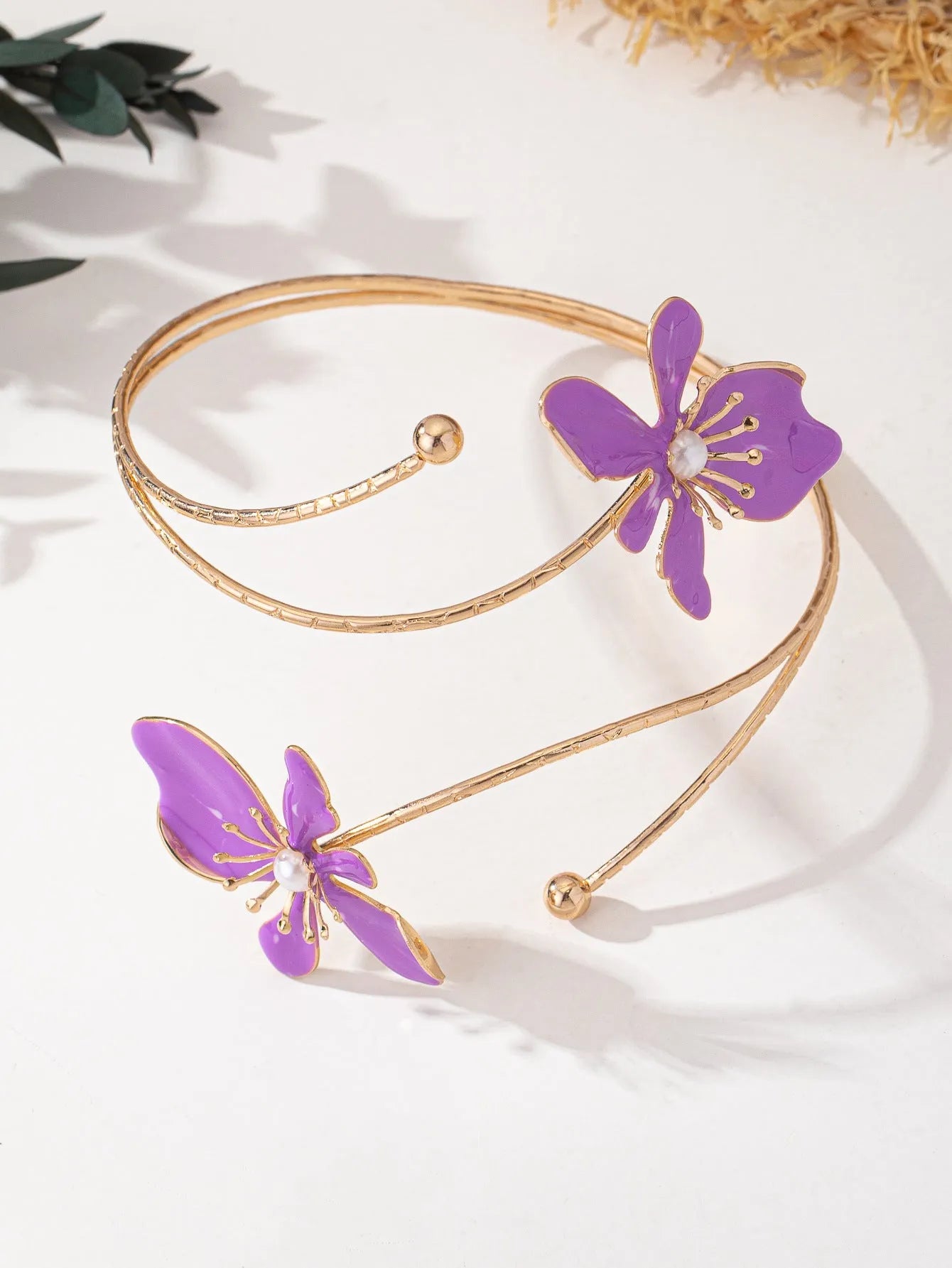 Pink alloy armband with hollow line pattern design on wrist