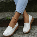 Women's PU leather slip-on loafers in round toe flat heel design showing car suture detailing