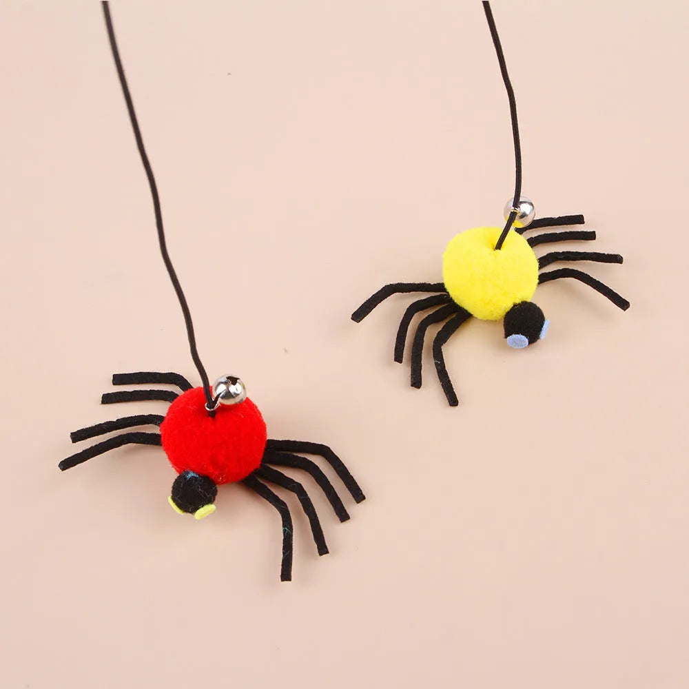 Red cat door hanging toy with elastic rope, feathers, bell, and spider attachments for interactive play