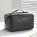 Cubic pillow makeup bag with vertical pattern in five colour options showing 22.5cm dimensions