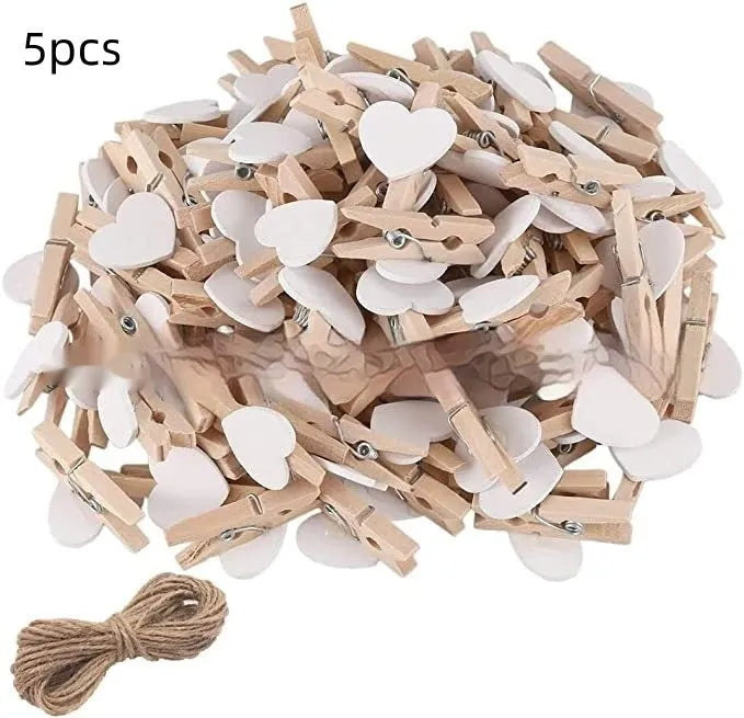 Pack of five solid wood heart-shaped clips in assorted colours on a white background.