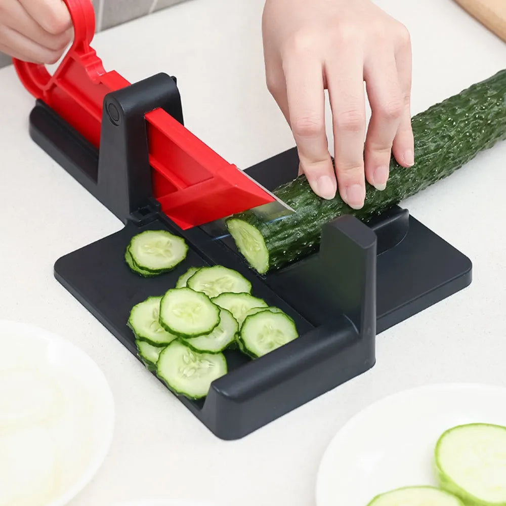 Green and red modern vegetable cutting tool for carrots and potatoes on a kitchen counter