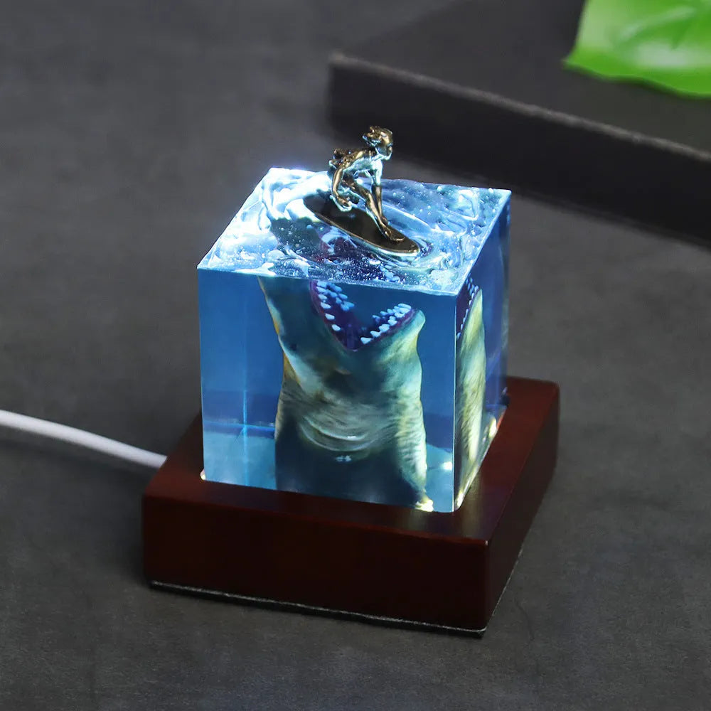 Clear epoxy resin shark surfer night light ornament with LED, modern design in 5cm or 8cm size.