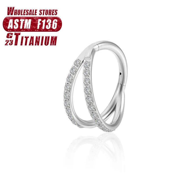 Titanium alloy fork nose ring for body piercing in silver colour on a grey background.