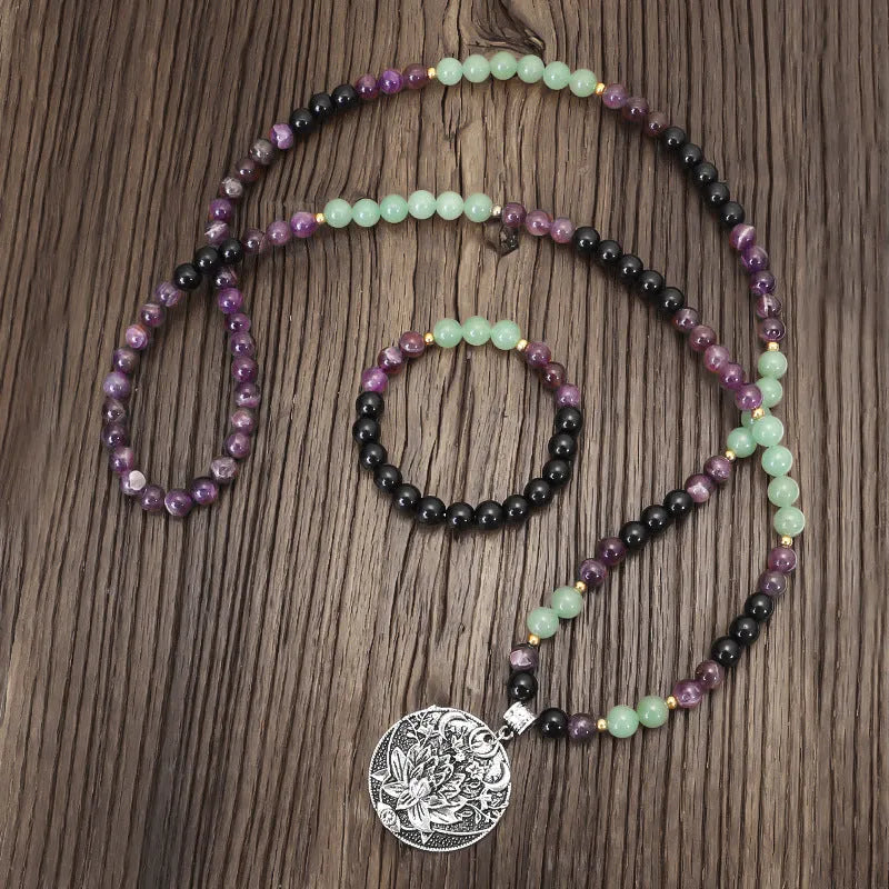 Dongling long yoga lotus pendant necklace and bracelet set with geometric alloy pendant and stone beads.
