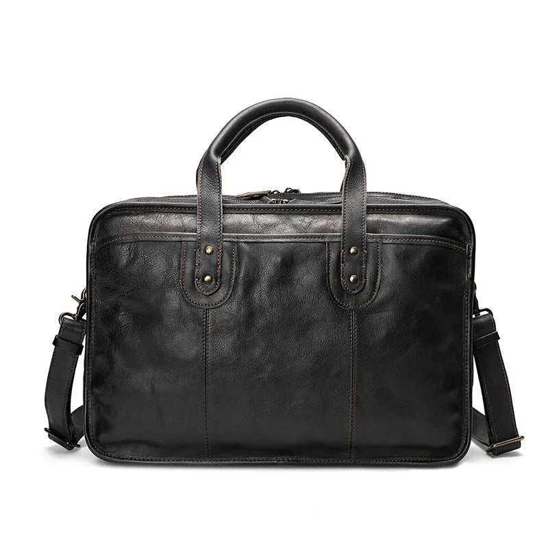 Large brown leather men's briefcase showing multiple internal compartments and organisation pockets