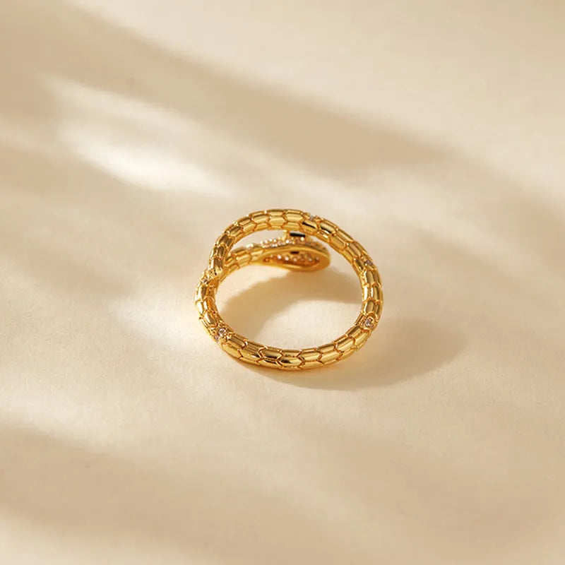 Snake-shaped adjustable copper ring with 18K gold colour finish and detailed animal modelling