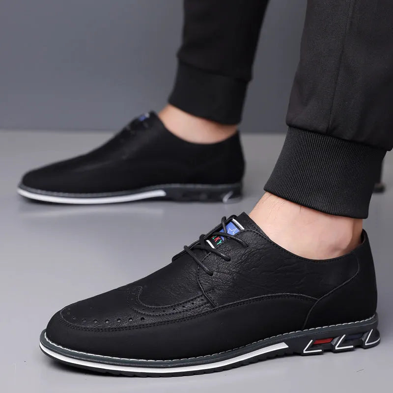 Men's black casual leather slip-on shoe with rubber sole and leather toe cap detail