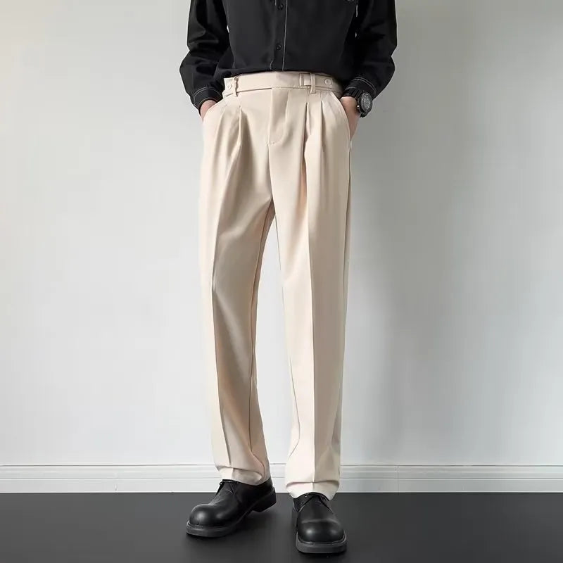 Men's straight-loose fit suit trousers in apricot colour hanging on a hanger.