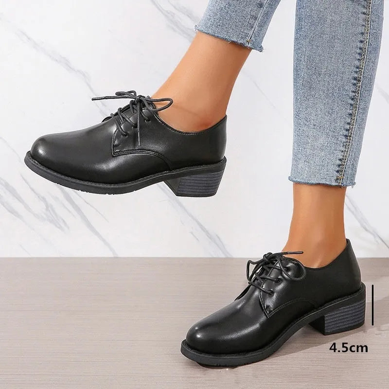 Black women's work shoes with thick chunky heel, PU leather upper, and rubber sole