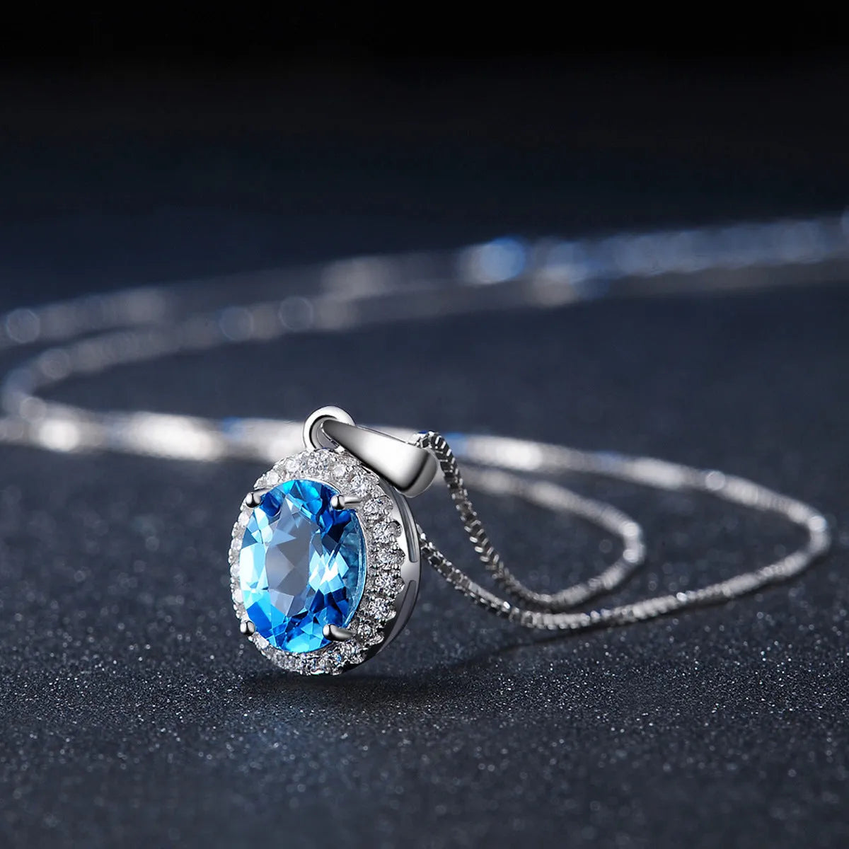 925 sterling silver blue topaz geometric jewellery set with earrings, ring, necklace, and pendant