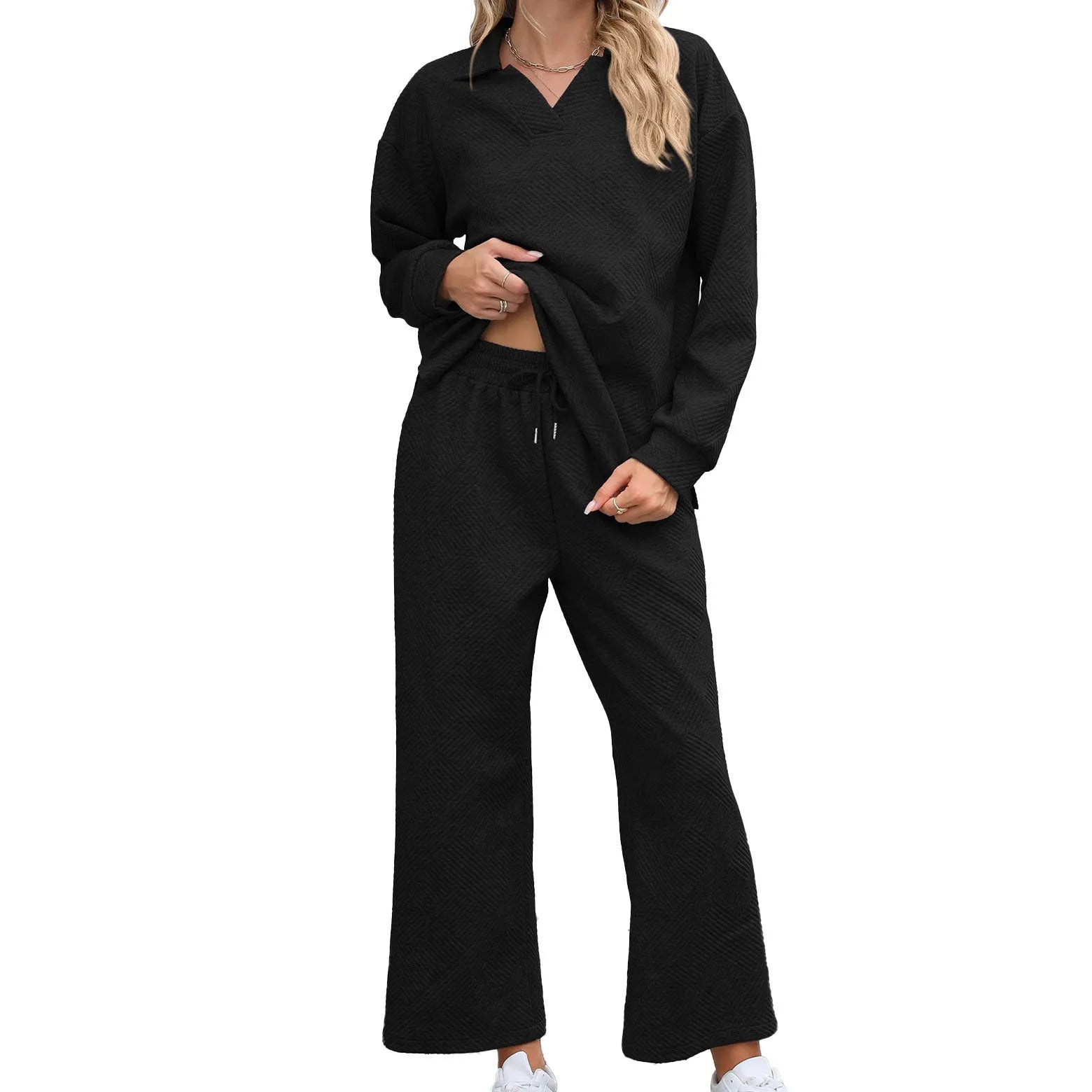 Women's solid colour lapel long sleeve knit jumpsuit with elastic waist trousers in jacquard fabric.