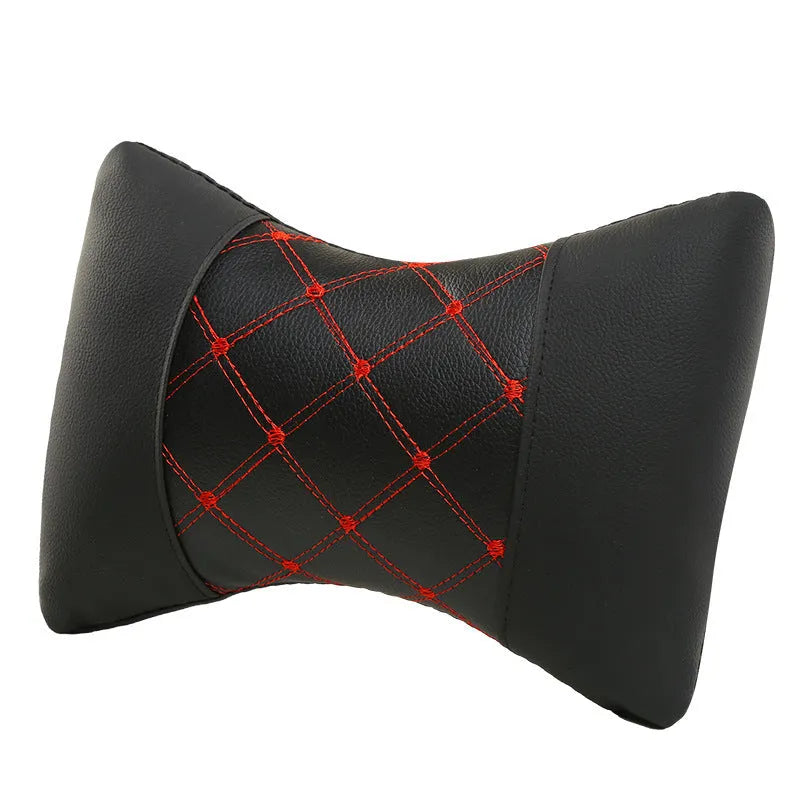 Black leather quilted car headrest pillow with contrast piping for cervical neck support