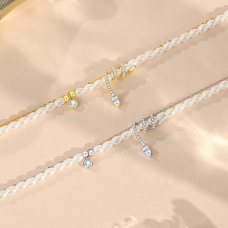 Pearl snake bracelet in 925 silver with electroplated gold or white gold colour on a wrist.