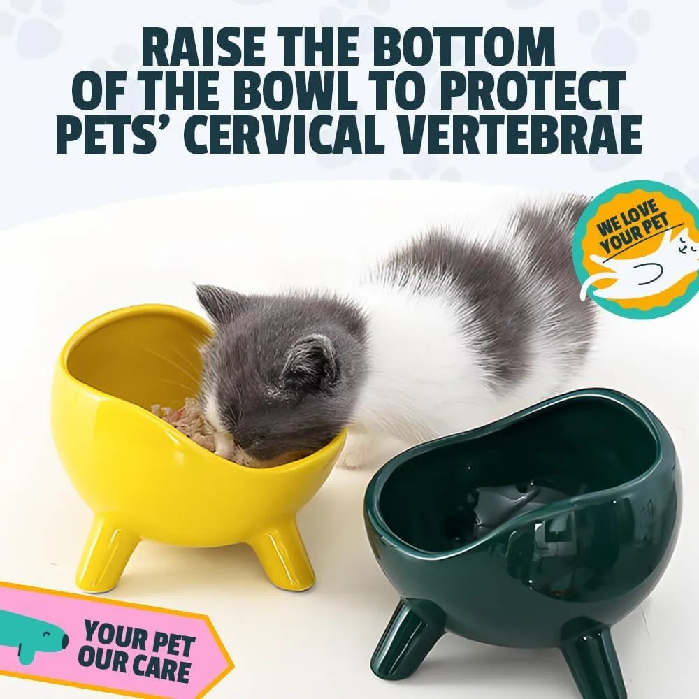 Green ceramic cat food bowl with four legs and rounded arc design on wooden floor