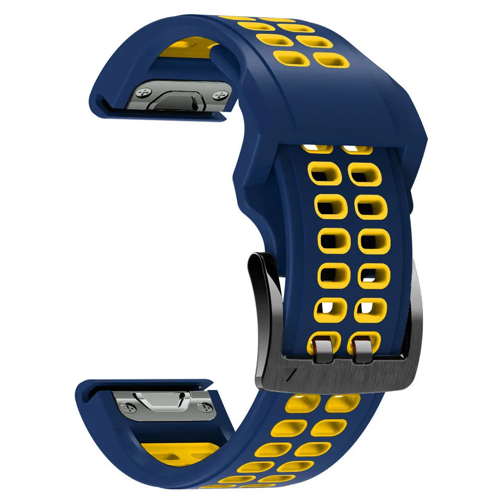 Close-up of a two-tone black and orange silicone watch strap with quick-release pins and a pin buckle.