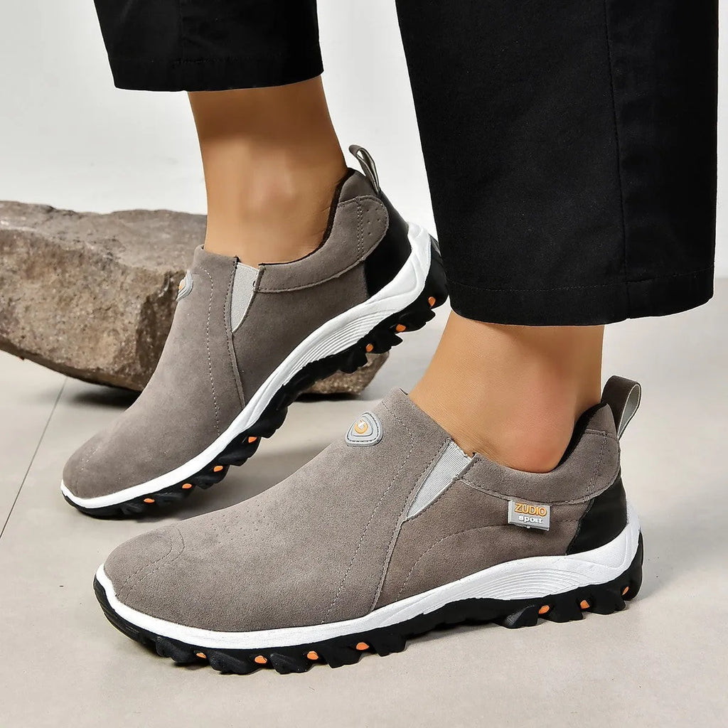 Men's grey PU slip-on overshoes with a round toe and rubber sole, shown on a foot.