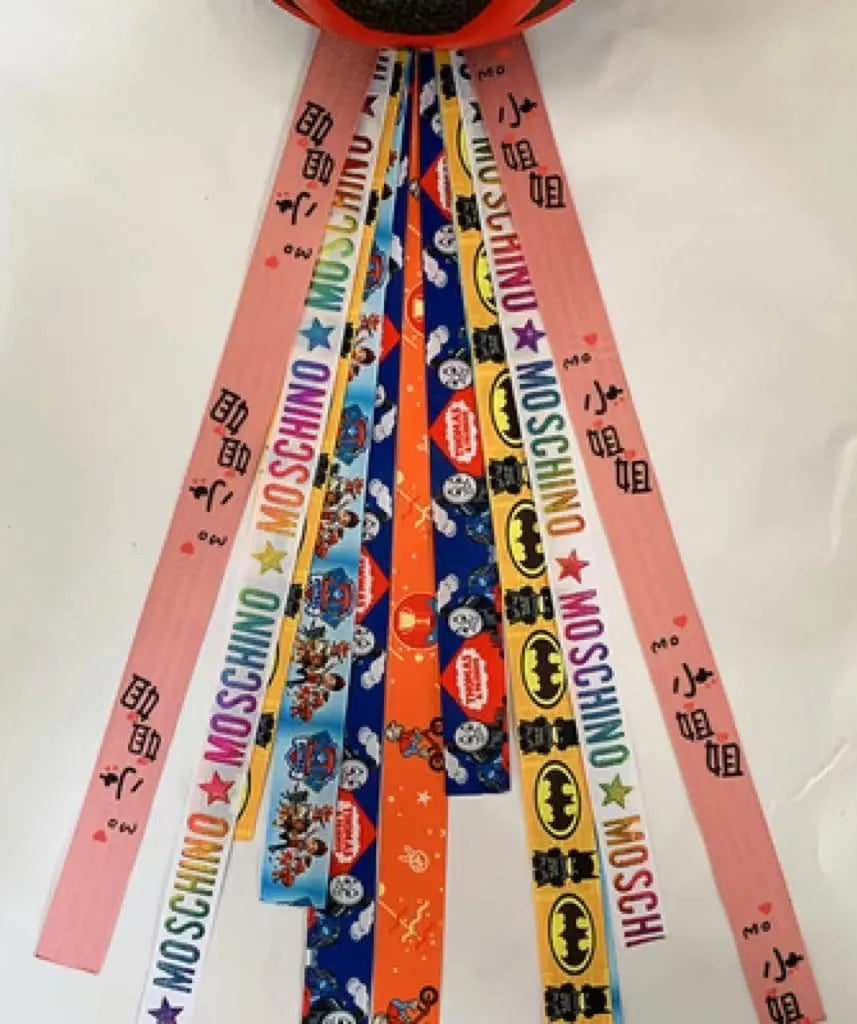 Children's decorative helmet streamer ribbon in multiple colours for roller skating and skiing safety gear.