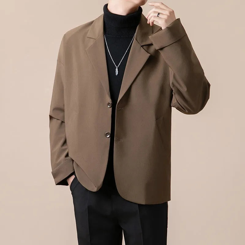 A man's loose-fit casual suit jacket in a polyester blend fabric, shown in one of four available colours.
