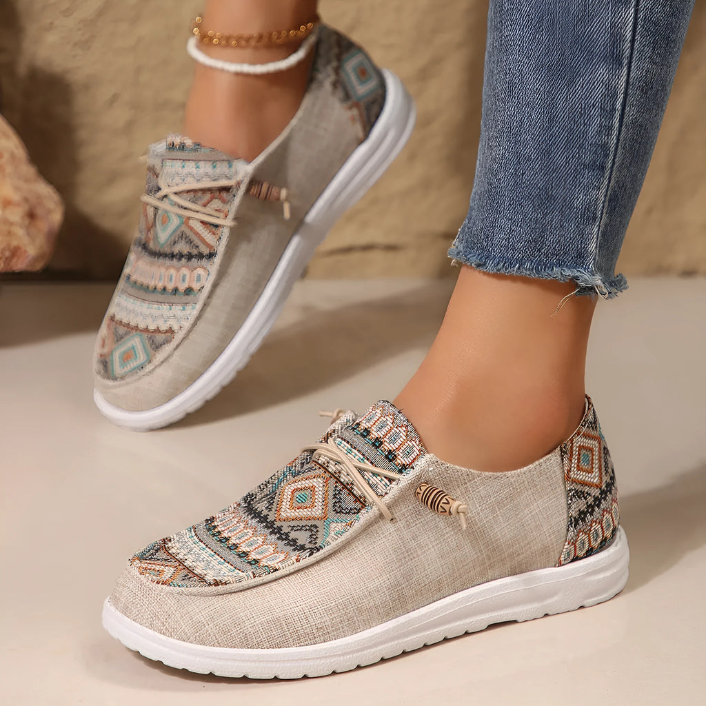 Women's black slip-on flat shoes with round toe and artificial PU upper