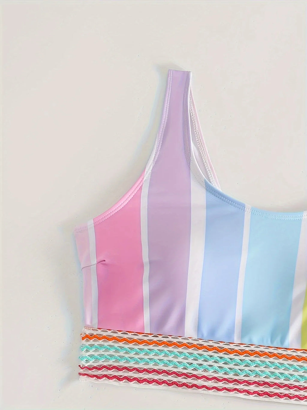 Women's striped two-piece sports bikini swimwear set on a mannequin.