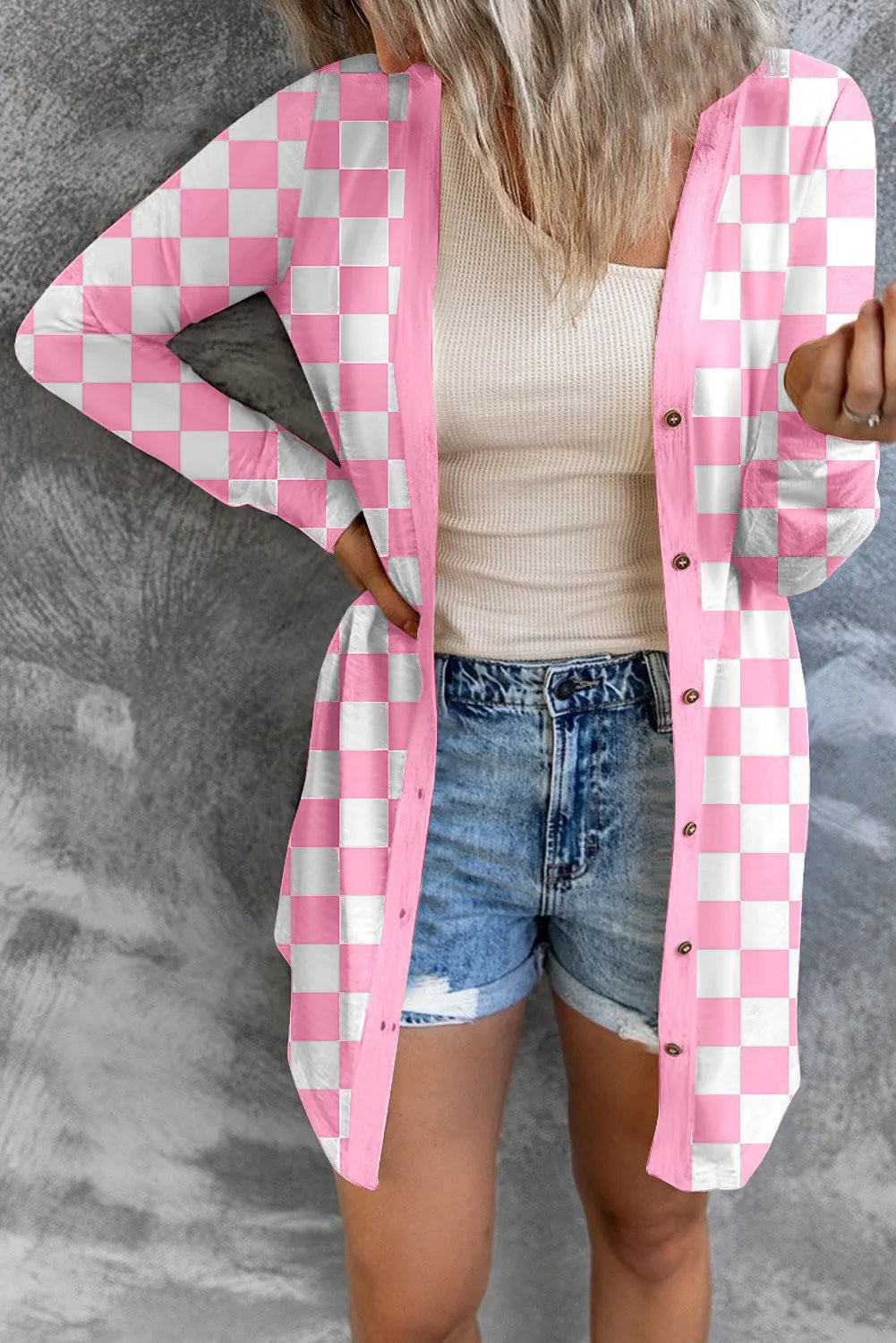 Women's long grey plaid knitted cardigan coat with regular sleeves on a hanger