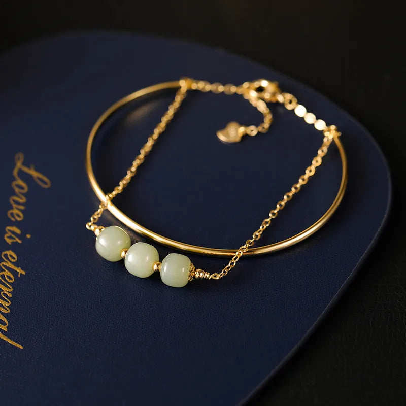 Women's Hetian jade bracelet with gold inlay detail, shown in single, double, and three bead versions.