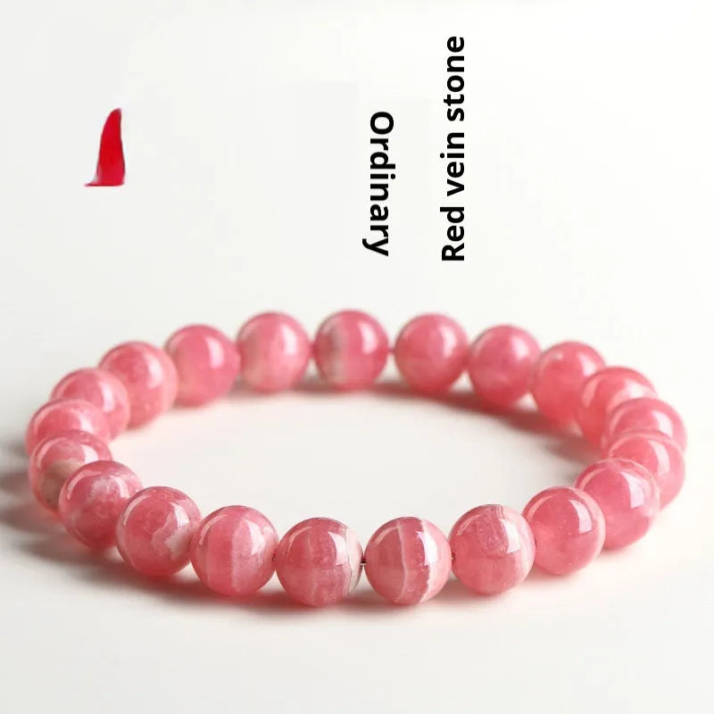 Women's geometric crystal bracelet with a red rhodochrosite stone and silver longevity lock clasp.