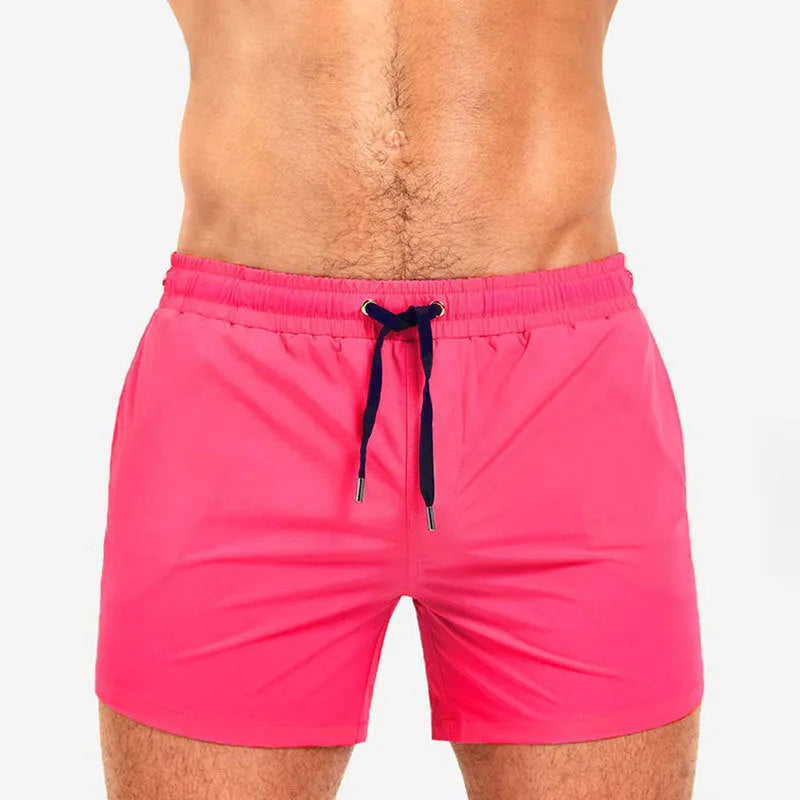 Men's solid colour mesh lining sports shorts for swimming and fitness in polyester fabric