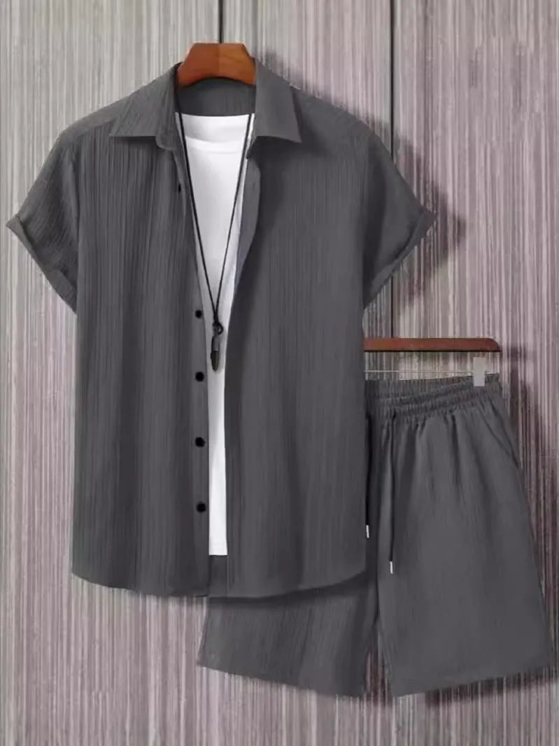 Man wearing black and white jacquard print short sleeve suit with shirt-style jacket and matching shorts