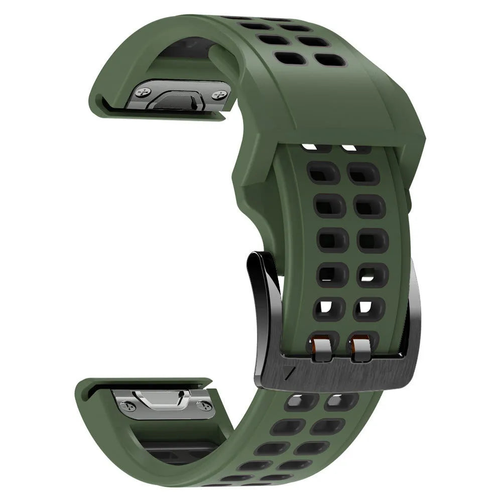 Close-up of a two-tone black and orange silicone watch strap with quick-release pins and a pin buckle.