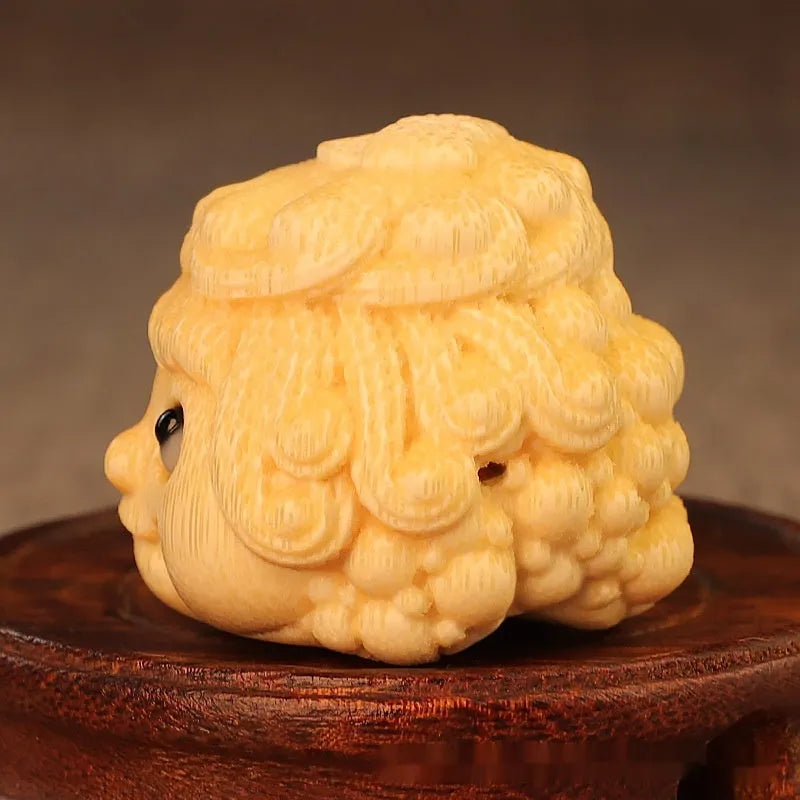 Solid bamboo golden toad princess ornament on a surface