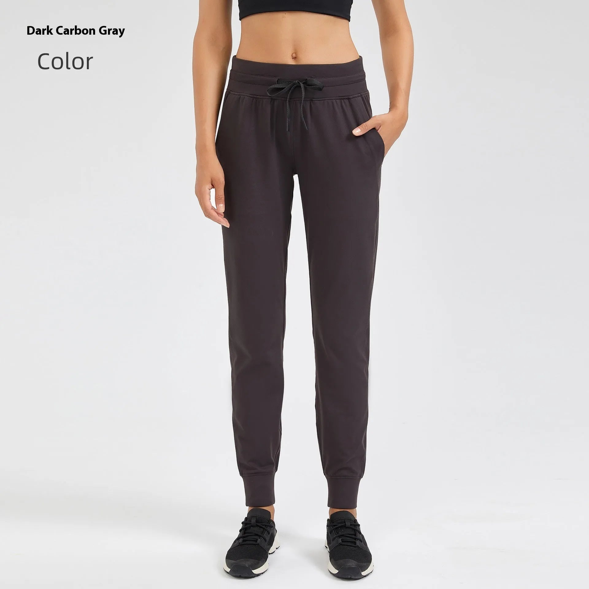 Women's high-waist yoga pants with drawstring waistband in a cotton blend fabric.