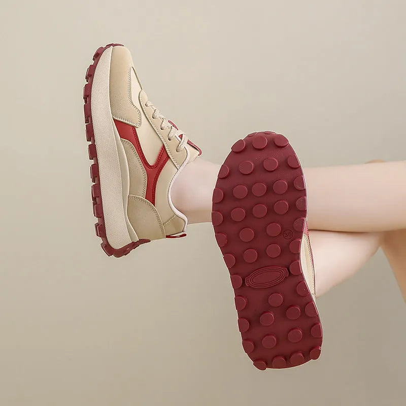 Women's low-top platform sports shoes in solid colours with lace-up front and mesh lining.
