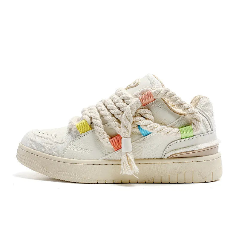 Creamy white retro low-top skateboard shoes with platform heel and lace-up front.