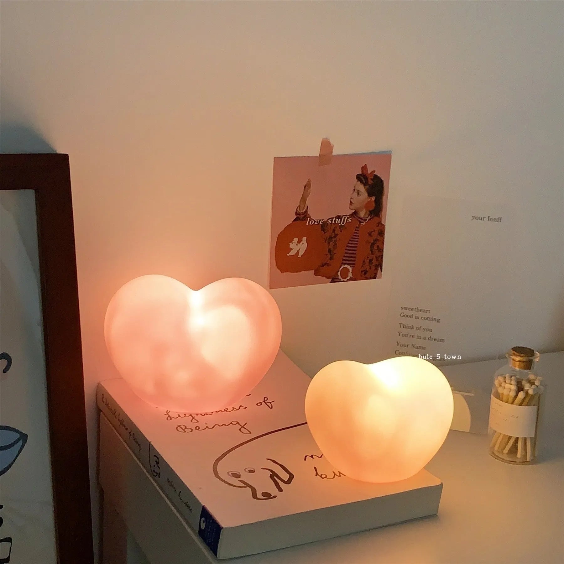 Small vinyl atmosphere lamp with warm glowing light in trumpet shape available in pink or white