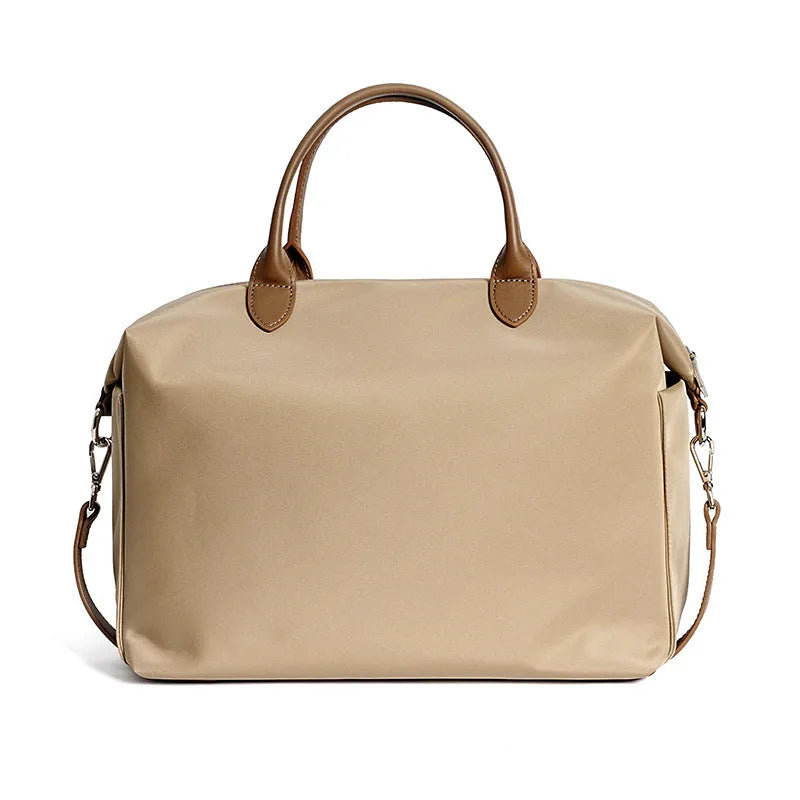 Black waterproof nylon shoulder bag with leather trim showing front view and interior