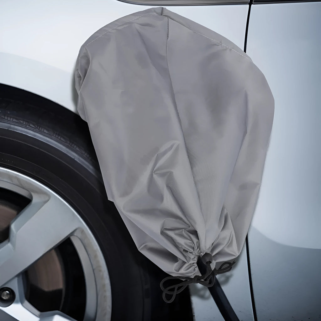 Waterproof cover for new energy vehicle charging port in grey colour showing drawstring closure
