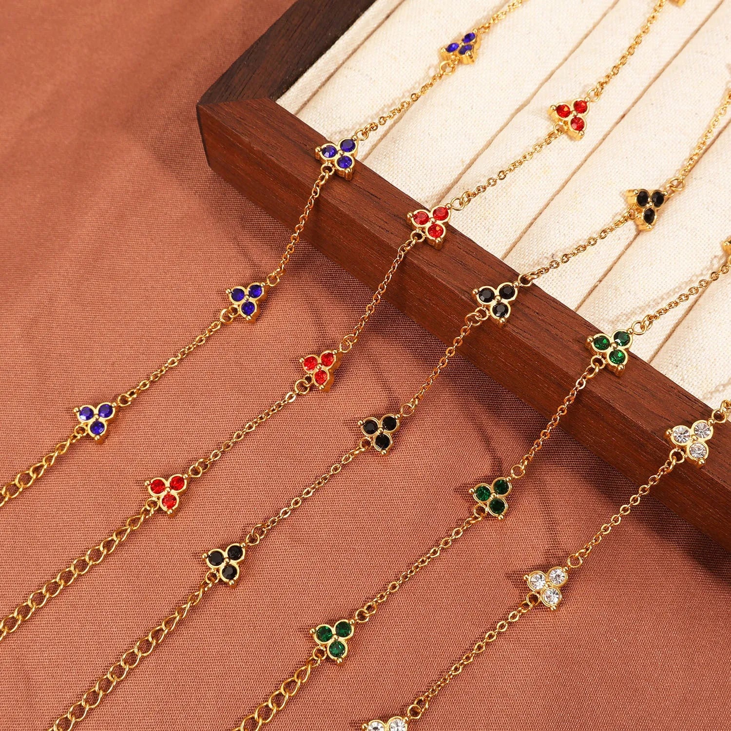 Women's geometric bracelet with triangular diamond cluster in gold or steel stainless steel with coloured stones