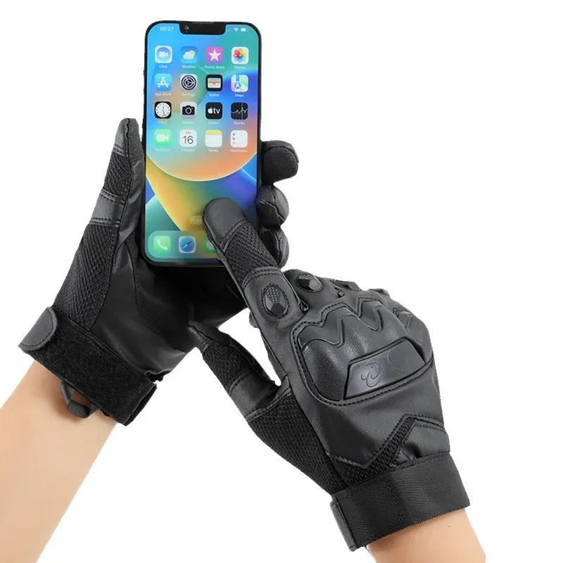 Men's black full finger tactical gloves with touch screen compatible fingertips on a hand.